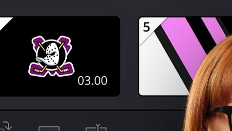 A woman stands smiling in front of a background comprised of various screengrabs from DaVinci Resolve.