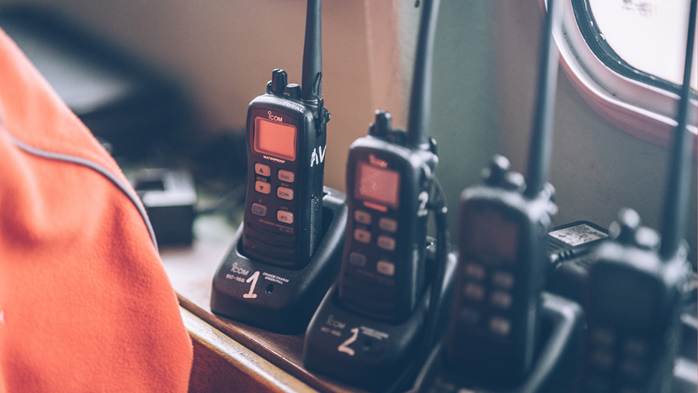 A line of walkie talkies in an office