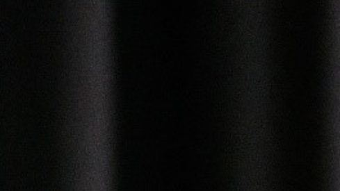John Yorke sits smiling away from the camera. A banner at the bottom of the image reads "Dialogue with John Yorke" with the MediaXchange logo in the bottom right corner.