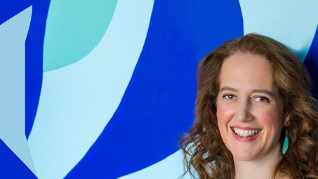 Debra Coleman stands smiling against a blue graphic background. The Open Frame Coaching logo is to the right of her.